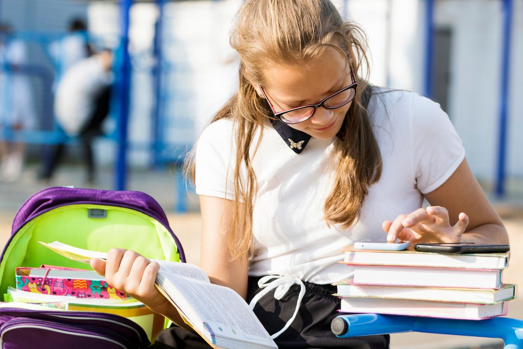 Portrait,Of,A,Schoolgirl,With,Glasses,On,The,Street